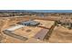 An aerial view reveals a modern home with a spacious lot and long driveway, perfect for desert living at 4740 W Agate Ave, Las Vegas, NV 89139