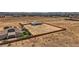 Spacious desert lot featuring two homes surrounded by a brick wall in a sunny landscape at 4740 W Agate Ave, Las Vegas, NV 89139