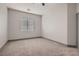 A spacious bedroom is brightened by natural light from the window at 4740 W Agate Ave, Las Vegas, NV 89139
