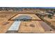 Aerial view of a desert home with an oversized lot, long driveways, and ample space for expansion or customization at 4740 W Agate Ave, Las Vegas, NV 89139