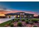 Beautiful single-story home featuring desert landscaping, a three-car garage, and a stylish stone-accented entryway at 4740 W Agate Ave, Las Vegas, NV 89139