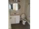 Bathroom features include a vanity, an oval mirror, and a toilet next to a shower stall at 5115 Blossom Ave, Las Vegas, NV 89142