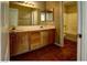 Bathroom featuring a double sink vanity with wood cabinets and a shower with a bathtub at 5115 Blossom Ave, Las Vegas, NV 89142