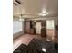 Functional kitchen featuring wood cabinets, granite countertops, and ceramic tile floors, ample space at 5115 Blossom Ave, Las Vegas, NV 89142