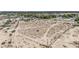 An aerial view of a large lot surrounded by desert vegetation and light fencing at 5280 Shreve Ave, Las Vegas, NV 89156