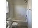 Bathroom featuring shower-tub combination, granite countertop and white toilet at 5280 Shreve Ave, Las Vegas, NV 89156