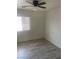 Bedroom featuring neutral color walls, light colored floors and window with blinds at 5280 Shreve Ave, Las Vegas, NV 89156