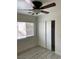 Bedroom with light colored walls, light colored floors, closet and ceiling fan at 5280 Shreve Ave, Las Vegas, NV 89156