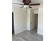 Bedroom featuring light colored walls, ceiling fan, light colored flooring and white trim at 5280 Shreve Ave, Las Vegas, NV 89156