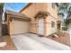 Attached garage providing convenient parking with an adjacent front entrance at 5280 Shreve Ave, Las Vegas, NV 89156