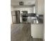 Bright kitchen featuring white cabinets, granite counters, and stainless steel appliances at 5280 Shreve Ave, Las Vegas, NV 89156