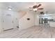 Inviting living space with gray wood-look floors and an open layout at 5280 Shreve Ave, Las Vegas, NV 89156