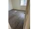 Neutral bedroom featuring wood-style flooring and a window at 5284 Wellesley Ave, Las Vegas, NV 89122