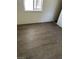 Neutral bedroom featuring wood-style flooring and a window at 5284 Wellesley Ave, Las Vegas, NV 89122