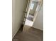 The bedroom has wood-look floors that pair well with the neutral wall colors at 5284 Wellesley Ave, Las Vegas, NV 89122