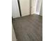 This bedroom features wood-look floors, neutral walls, and a modern closet at 5284 Wellesley Ave, Las Vegas, NV 89122