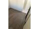 This bedroom features wood-look floors and access to the en-suite bathroom at 5284 Wellesley Ave, Las Vegas, NV 89122