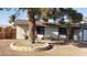 Cozy home featuring neutral stucco exterior and a tree in the front yard at 5284 Wellesley Ave, Las Vegas, NV 89122