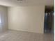 Spacious living room with tiled floors and view into hallway at 5284 Wellesley Ave, Las Vegas, NV 89122