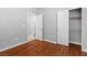 Comfortable bedroom featuring hardwood floors, a closet, and a bright, airy feel at 5452 Tinker Toy Ave, Las Vegas, NV 89139
