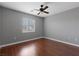 Bedroom features wood floors, ceiling fan and a window at 5452 Tinker Toy Ave, Las Vegas, NV 89139
