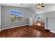 Open living area with hardwood floors, vaulted ceilings, and plenty of natural light at 5452 Tinker Toy Ave, Las Vegas, NV 89139