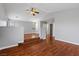 Bright and airy living area featuring hardwood floors and large windows providing ample natural light at 5452 Tinker Toy Ave, Las Vegas, NV 89139