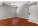 Spacious living room with beautiful wood floors, ceiling fan and natural light at 5452 Tinker Toy Ave, Las Vegas, NV 89139