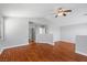 Spacious living area with hardwood floors, neutral walls, and a ceiling fan for a modern touch at 5452 Tinker Toy Ave, Las Vegas, NV 89139
