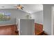 Spacious living area with vaulted ceilings, hardwood floors, and ample natural light from large windows at 5452 Tinker Toy Ave, Las Vegas, NV 89139
