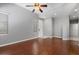 Open-concept living room with wood floors and neutral paint, great for entertaining at 5452 Tinker Toy Ave, Las Vegas, NV 89139
