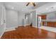 Open-concept living room flows into kitchen with wood floors and natural light at 5452 Tinker Toy Ave, Las Vegas, NV 89139