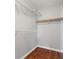 Bright walk-in closet featuring built in shelving and wood floors at 5452 Tinker Toy Ave, Las Vegas, NV 89139