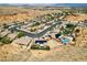 Aerial view of a desert community featuring homes with pools and well-maintained landscaping at 574 Desert Tortoise Way, Mesquite, NV 89027