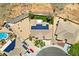Aerial view of desert community featuring homes with solar panels and in-ground pools at 574 Desert Tortoise Way, Mesquite, NV 89027