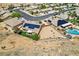 Aerial view of desert home with solar panels, spacious yard, and neighborhood at 574 Desert Tortoise Way, Mesquite, NV 89027