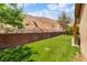 Expansive backyard with lush green lawn, desert landscaping, and hillside views at 574 Desert Tortoise Way, Mesquite, NV 89027
