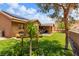 Well-manicured backyard with mature landscaping and covered patio at 574 Desert Tortoise Way, Mesquite, NV 89027