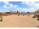 Large backyard featuring desert landscaping with a tan gravel ground cover at 574 Desert Tortoise Way, Mesquite, NV 89027
