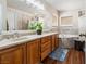 A primary bathroom with double sinks, a garden tub, and wood-look flooring at 574 Desert Tortoise Way, Mesquite, NV 89027