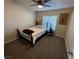 Comfortable bedroom with a wrought iron bed frame and a plant-filled bedside table at 574 Desert Tortoise Way, Mesquite, NV 89027