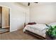 A bright bedroom with carpeted floors, a double door closet, and a view to the hallway and entry at 574 Desert Tortoise Way, Mesquite, NV 89027