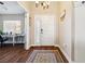 Open foyer showcases hardwood floors, a white front door, and views to a desk nook at 574 Desert Tortoise Way, Mesquite, NV 89027
