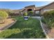 Well-maintained front yard with lush green lawn and desert landscaping at 574 Desert Tortoise Way, Mesquite, NV 89027