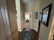 Hallway with wood floors and view into the main bedroom at 574 Desert Tortoise Way, Mesquite, NV 89027