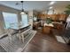 Charming kitchen with stainless appliances, wood cabinets, and a cozy dining area at 574 Desert Tortoise Way, Mesquite, NV 89027