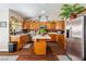 Well-equipped kitchen featuring wooden cabinetry, stainless steel appliances, and a functional center island at 574 Desert Tortoise Way, Mesquite, NV 89027