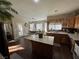 Bright kitchen featuring an island, modern appliances, and a view to the outdoor patio at 574 Desert Tortoise Way, Mesquite, NV 89027