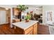 Open kitchen with stainless steel refrigerator, a center island, and a view of the living room at 574 Desert Tortoise Way, Mesquite, NV 89027