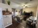 Comfortable living room features a ceiling fan, a cozy sofa, and neutral tones at 574 Desert Tortoise Way, Mesquite, NV 89027